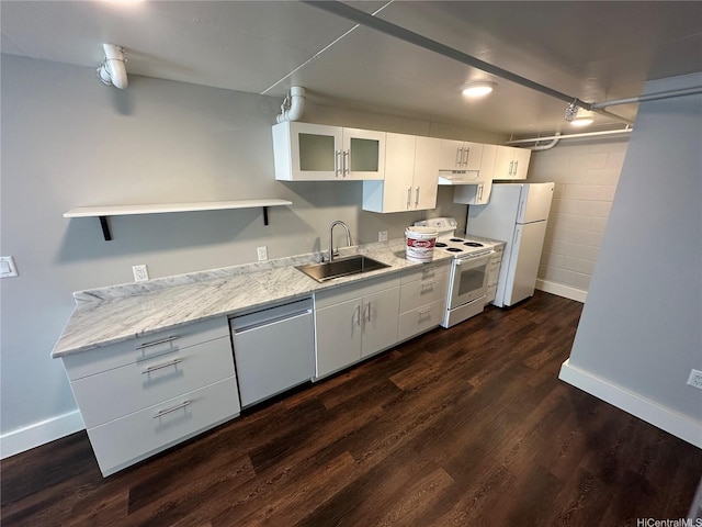 803 Waimanu St Unit 109, Honolulu, HI 96813 - kitchen featuring white appliances, a sink, baseboards, and white cabinets