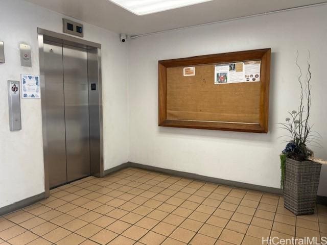 1550 Rycroft St Unit 528, Honolulu, HI 96814 - corridor featuring elevator, baseboards, and light tile patterned floors
