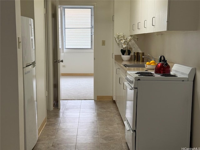 1550 Rycroft St Unit 528, Honolulu, HI 96814 - kitchen featuring white appliances, a sink, white cabinetry, light carpet, and baseboards
