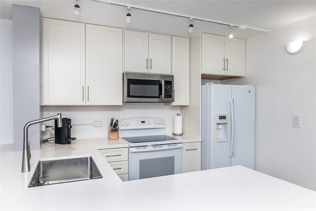 1545 Nehoa St Unit 802, Honolulu, HI 96822 - kitchen featuring white appliances, a sink, backsplash, light countertops, and white cabinets