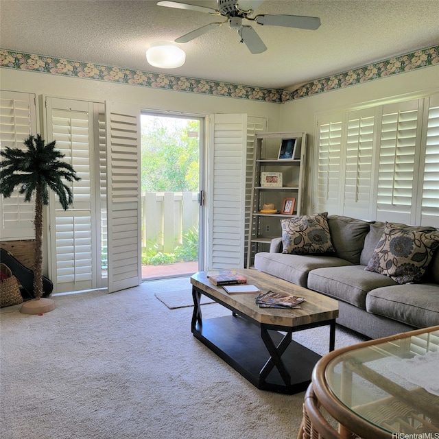 95-1050 Makaikai St Unit 16C, Mililani, HI 96789 - living area with carpet, a textured ceiling, and ceiling fan