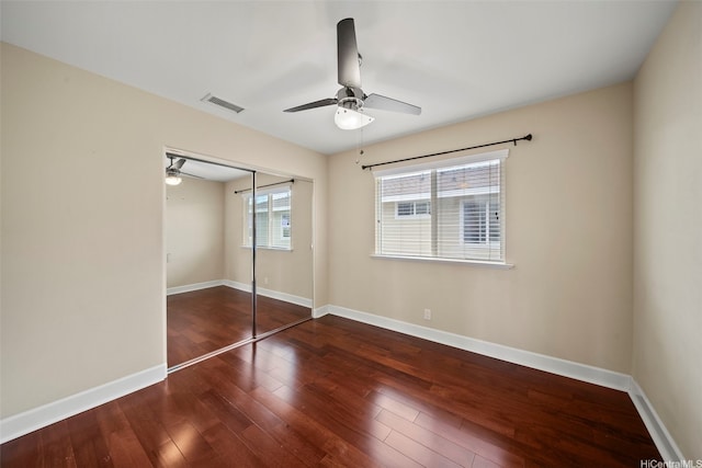 91-1304 Kaikohola St Unit D41, Ewa Beach, HI 96706 - unfurnished bedroom with hardwood / wood-style floors, a closet, baseboards, and a ceiling fan