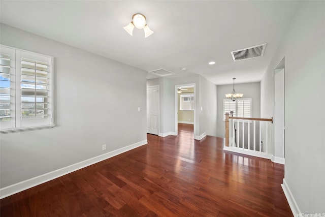 91-1304 Kaikohola St Unit D41, Ewa Beach, HI 96706 - unfurnished room with wood finished floors, baseboards, and a chandelier