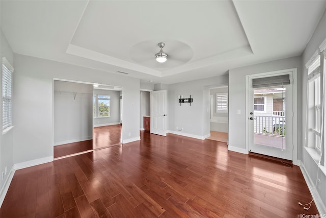 91-1304 Kaikohola St Unit D41, Ewa Beach, HI 96706 - unfurnished bedroom with a raised ceiling, wood finished floors, baseboards, and a ceiling fan