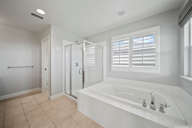 91-1304 Kaikohola St Unit D41, Ewa Beach, HI 96706 - bathroom featuring a garden tub, a stall shower, tile patterned floors, and baseboards