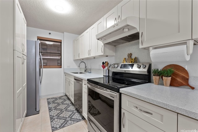 98-501 Koauka Loop Unit A704, Aiea, HI 96701 - kitchen with stainless steel appliances, under cabinet range hood, a sink, white cabinets, and a textured ceiling