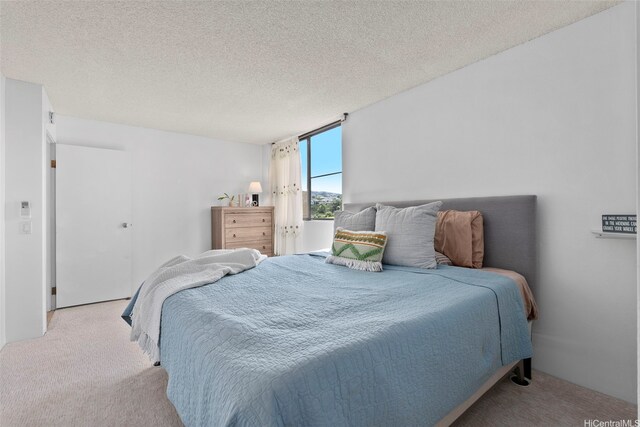 98-501 Koauka Loop Unit A704, Aiea, HI 96701 - bedroom with carpet flooring and a textured ceiling