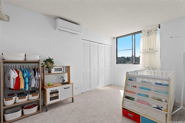 98-501 Koauka Loop Unit A704, Aiea, HI 96701 - carpeted bedroom featuring a wall unit AC and a textured ceiling
