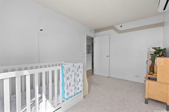 98-501 Koauka Loop Unit A704, Aiea, HI 96701 - carpeted bedroom with an AC wall unit and a crib