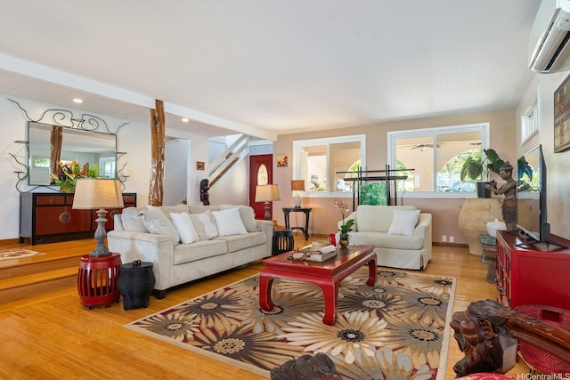 846 Mokulua Dr, Kailua, HI 96734 - living room with an AC wall unit, wood finished floors, stairway, and recessed lighting