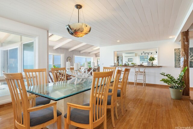 846 Mokulua Dr, Kailua, HI 96734 - dining room featuring wood ceiling with exposed beams, a wall mounted air conditioner, wood finished floors, and baseboards