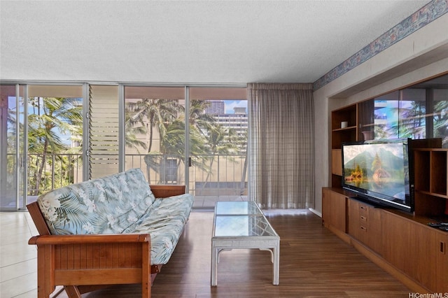 2115 Ala Wai Blvd Unit 501, Honolulu, HI 96815 - living room featuring expansive windows, wood finished floors, and a textured ceiling