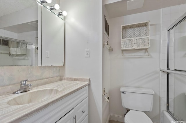2115 Ala Wai Blvd Unit 501, Honolulu, HI 96815 - bathroom featuring vanity, toilet, combined bath / shower with glass door, and baseboards