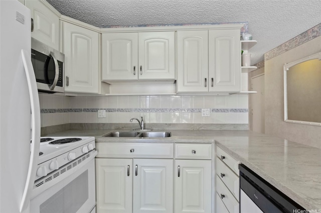 2115 Ala Wai Blvd Unit 501, Honolulu, HI 96815 - kitchen featuring white appliances, a sink, open shelves, a textured ceiling, and decorative backsplash
