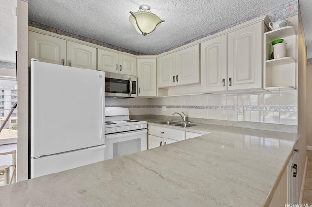 2115 Ala Wai Blvd Unit 501, Honolulu, HI 96815 - kitchen with white appliances, a sink, open shelves, a textured ceiling, and light stone counters