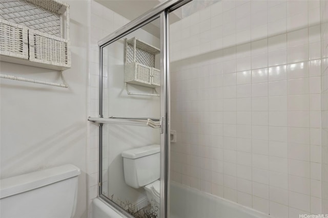 2115 Ala Wai Blvd Unit 501, Honolulu, HI 96815 - bathroom featuring toilet and shower / bath combination with glass door