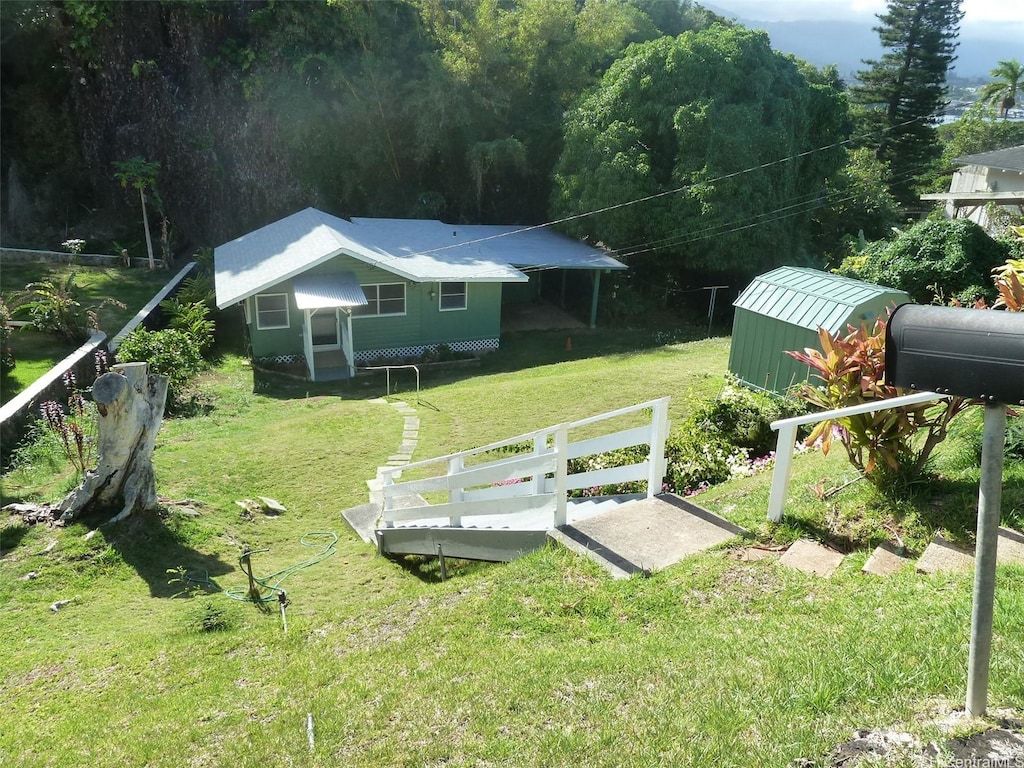 45-151 Kokokahi Pl, Kaneohe, HI 96744 - view of green lawn with an outbuilding