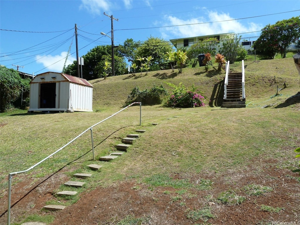 45-151 Kokokahi Pl, Kaneohe, HI 96744 - view of grassy yard with stairs