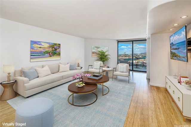 66 Queen St Unit 2904, Honolulu, HI 96813 - living room with light wood-style floors, floor to ceiling windows, and recessed lighting