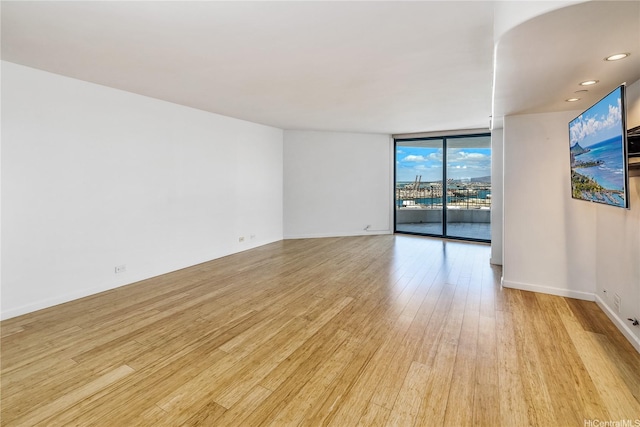 66 Queen St Unit 2904, Honolulu, HI 96813 - unfurnished room featuring light wood-style flooring and expansive windows