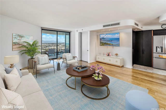 66 Queen St Unit 2904, Honolulu, HI 96813 - living room with floor to ceiling windows and light wood-style flooring