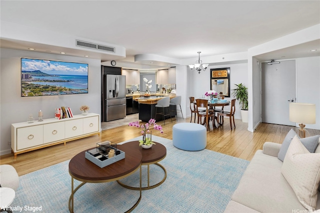 66 Queen St Unit 2904, Honolulu, HI 96813 - living area with light wood finished floors, a chandelier, and recessed lighting