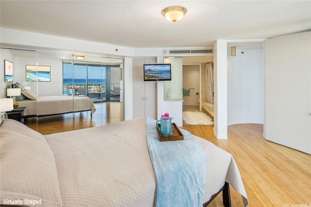 66 Queen St Unit 2904, Honolulu, HI 96813 - bedroom featuring wood finished floors
