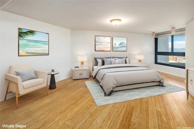 66 Queen St Unit 2904, Honolulu, HI 96813 - bedroom with light wood-style flooring and baseboards