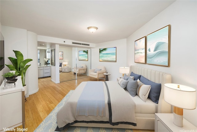 66 Queen St Unit 2904, Honolulu, HI 96813 - bedroom featuring light wood-type flooring