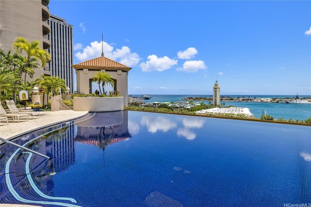 66 Queen St Unit 2904, Honolulu, HI 96813 - community pool featuring a water view and a patio area