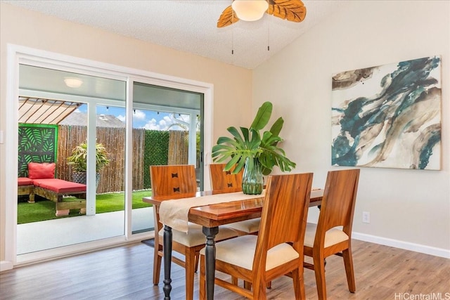 94-457 Akoa Pl, Mililani, HI 96789 - dining space featuring wood finished floors, vaulted ceiling, ceiling fan, and baseboards