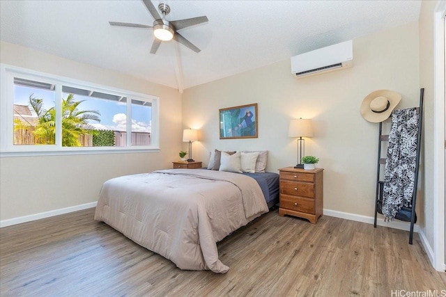 94-457 Akoa Pl, Mililani, HI 96789 - bedroom with a wall unit AC, wood finished floors, baseboards, lofted ceiling, and ceiling fan