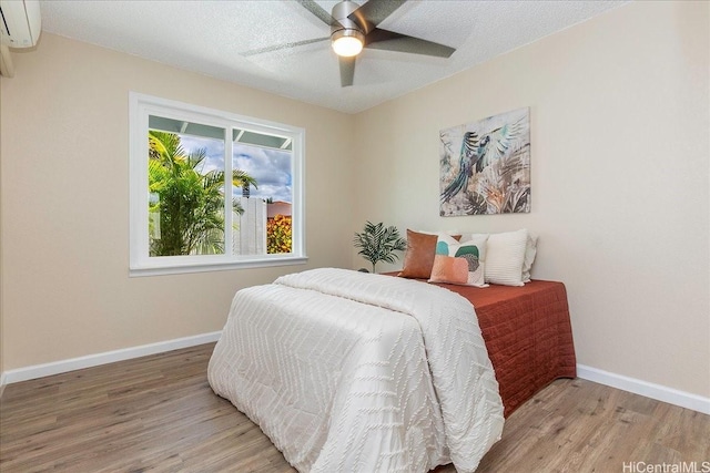 94-457 Akoa Pl, Mililani, HI 96789 - bedroom with wood finished floors, baseboards, and a wall mounted AC