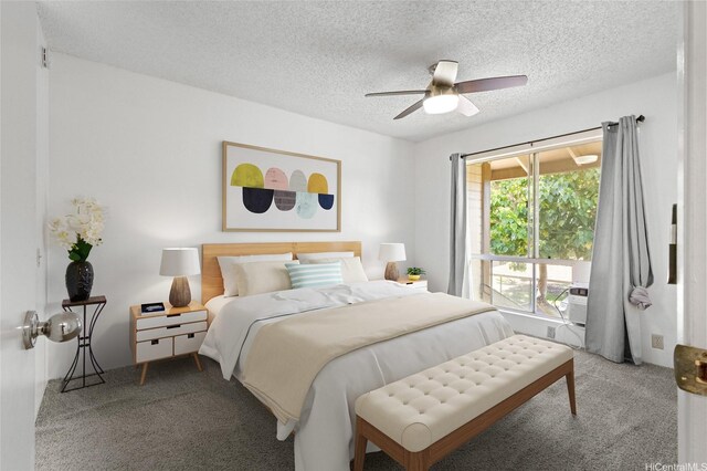 91-1040 Puamaeole St Unit 13R, Ewa Beach, HI 96706 - carpeted bedroom featuring a textured ceiling and a ceiling fan