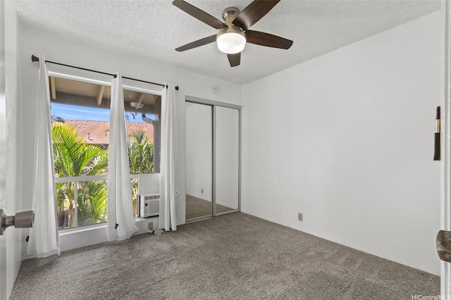 91-1040 Puamaeole St Unit 13R, Ewa Beach, HI 96706 - unfurnished bedroom with carpet flooring, cooling unit, a textured ceiling, a ceiling fan, and a closet