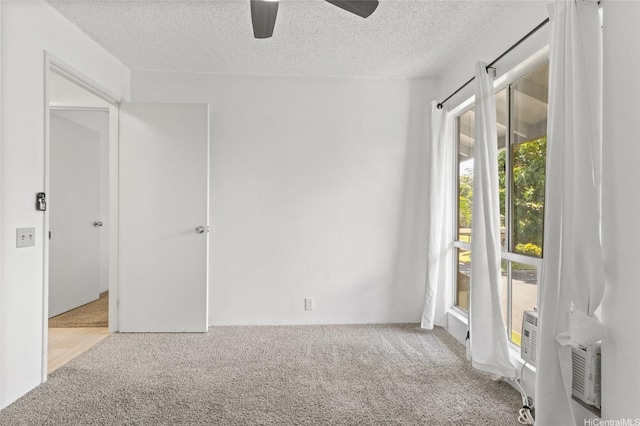 91-1040 Puamaeole St Unit 13R, Ewa Beach, HI 96706 - unfurnished room with carpet flooring, a ceiling fan, and a textured ceiling
