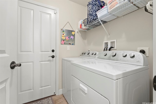 91-1158 Kai Oio St, Ewa Beach, HI 96706 - laundry room featuring separate washer and dryer and light tile patterned floors