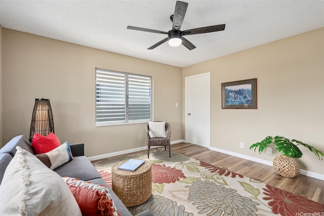 91-1338-A Karayan St, Ewa Beach, HI 96706 - living area featuring a ceiling fan, wood finished floors, baseboards, and a textured ceiling