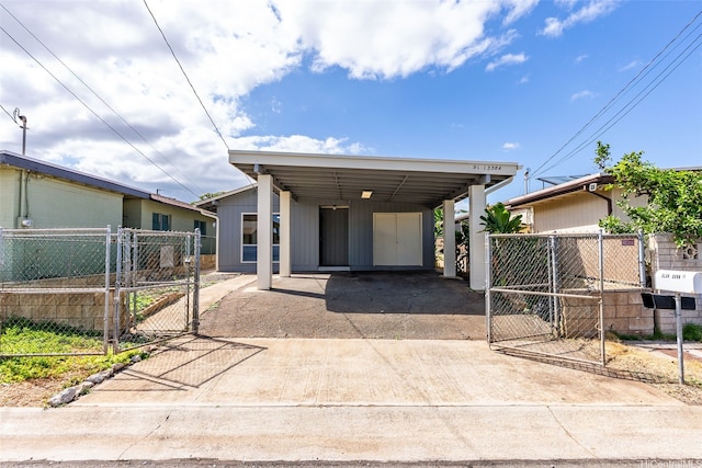 91-1338-A Karayan St, Ewa Beach, HI 96706 - view of front of house featuring a gate and driveway