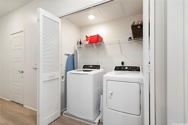 91-3524 Iwikuamoo St Unit 402, Ewa Beach, HI 96706 - washroom with washer and dryer, light wood finished floors, and attic access