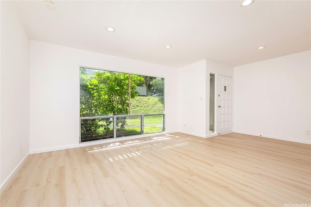 44-374 Olina St Unit 1, Kaneohe, HI 96744 - spare room with wood finished floors, recessed lighting, and baseboards
