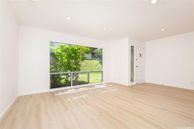 44-374 Olina St Unit 1, Kaneohe, HI 96744 - spare room featuring wood finished floors and recessed lighting