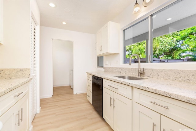 44-374 Olina St Unit 1, Kaneohe, HI 96744 - kitchen featuring a sink, black dishwasher, light wood-type flooring, white cabinetry, and light stone counters