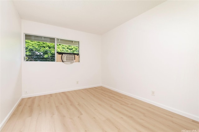 44-374 Olina St Unit 1, Kaneohe, HI 96744 - spare room with wood finished floors, baseboards, and cooling unit