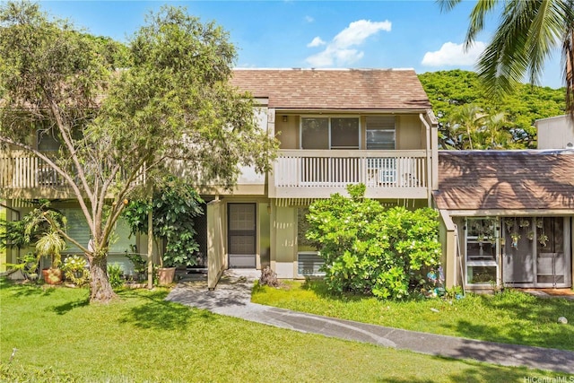 44-374 Olina St Unit 1, Kaneohe, HI 96744 - view of front of house featuring a balcony, a front lawn, and a shingled roof