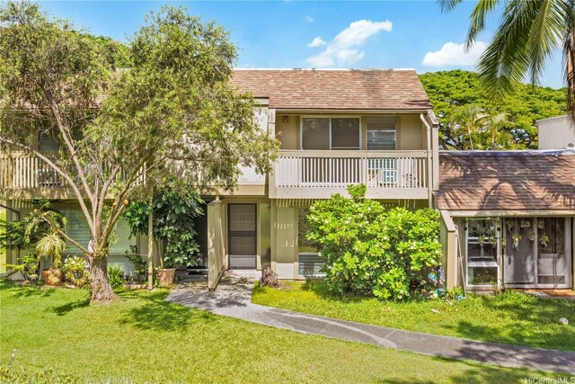 44-374 Olina St Unit 1, Kaneohe, HI 96744 - view of front of house featuring a balcony, a front yard, and roof with shingles