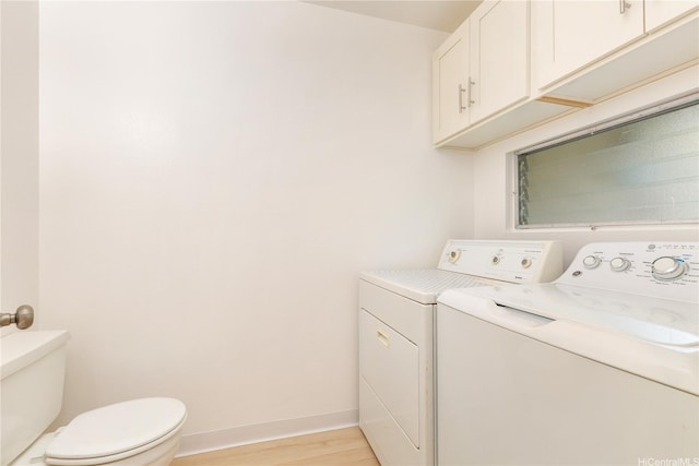 44-374 Olina St Unit 1, Kaneohe, HI 96744 - washroom with washer and clothes dryer, light wood-style floors, and baseboards