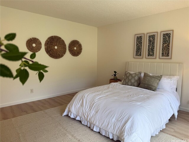 44-374 Olina St Unit 1, Kaneohe, HI 96744 - bedroom with wood finished floors and baseboards