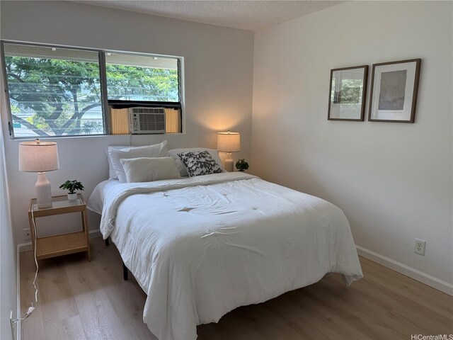 44-374 Olina St Unit 1, Kaneohe, HI 96744 - bedroom with light wood-style floors and cooling unit