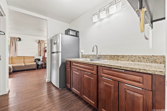 54-220 Kaipapau Loop, Hauula, HI 96717 - kitchen featuring a sink, freestanding refrigerator, dark wood-type flooring, black microwave, and light stone counters